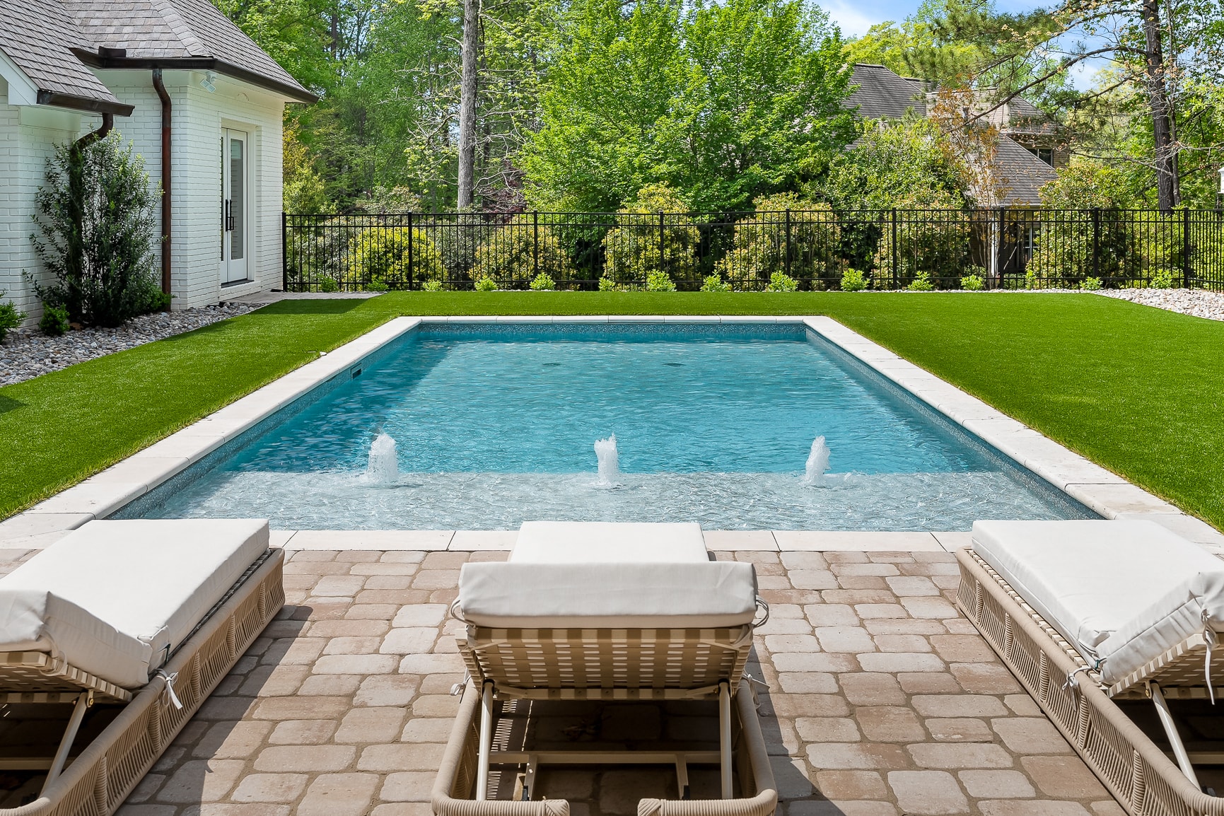 Resort-style pool and manicured lawn